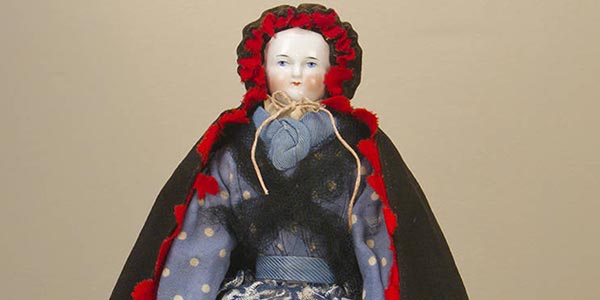 China doll with cape, circa 1860